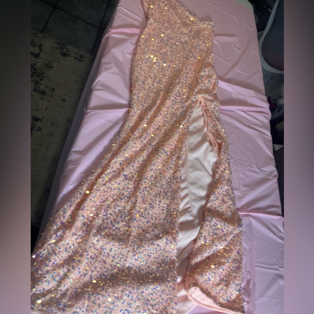 it's a long pink sequencing dress vary fitting and pretty